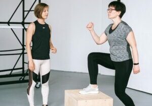 Woman stepping onto exercise block